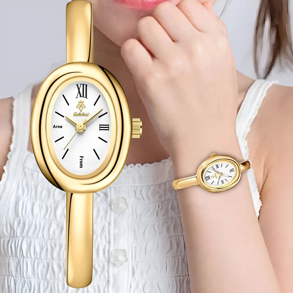 Women's gold and silver oval retro quartz watch with spiral pattern dial options on wrist.