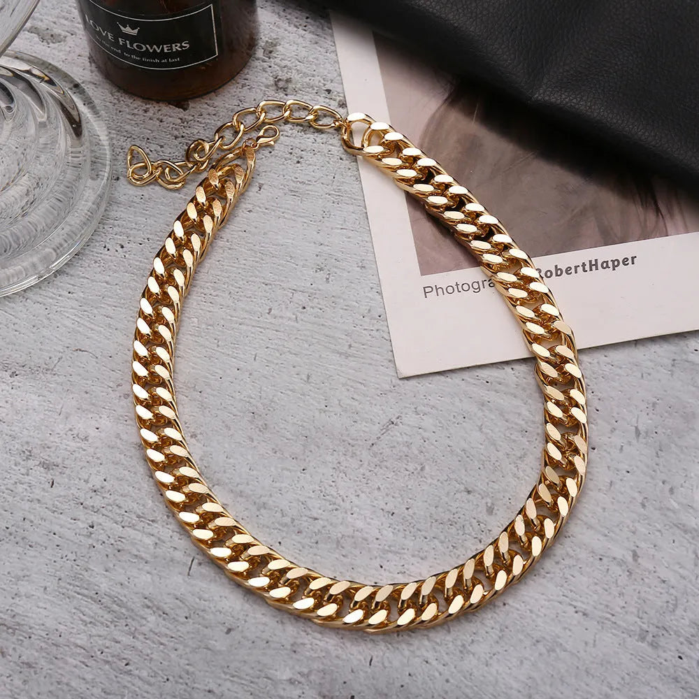 Gold coloured thick chain necklace for women, 32cm long with a 6cm pendant drop.