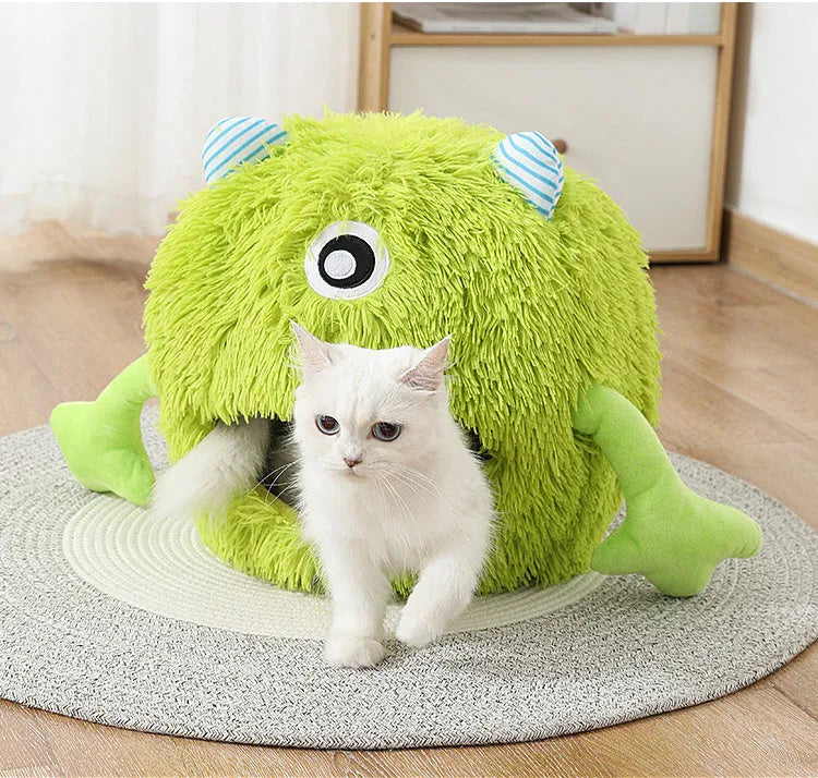 Fluffy round plush cat bed with a non-slip bottom, shown in grey.