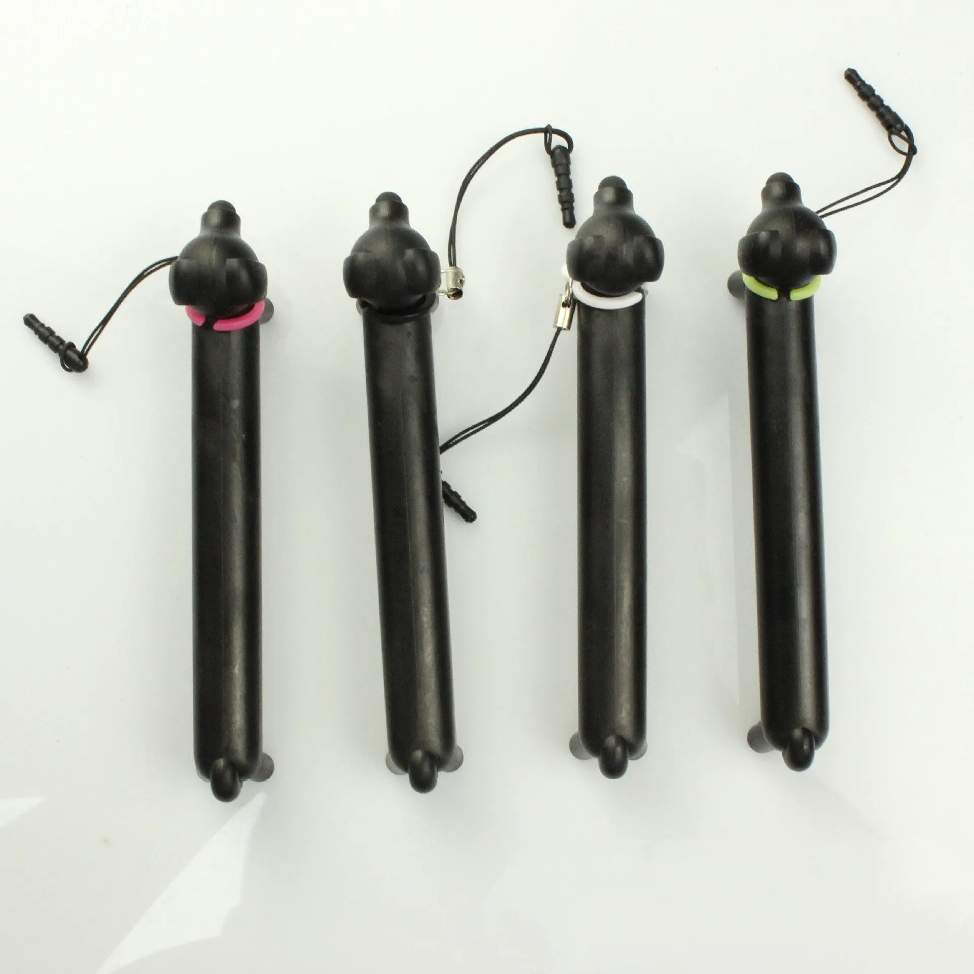 Black puppy-shaped touch screen stylus pen shown in dual-length positions with phone holder function