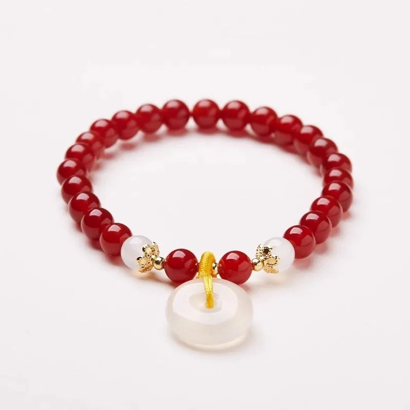 Handmade Chinese style bracelet with natural jinsi jade beads and traditional safety clasp