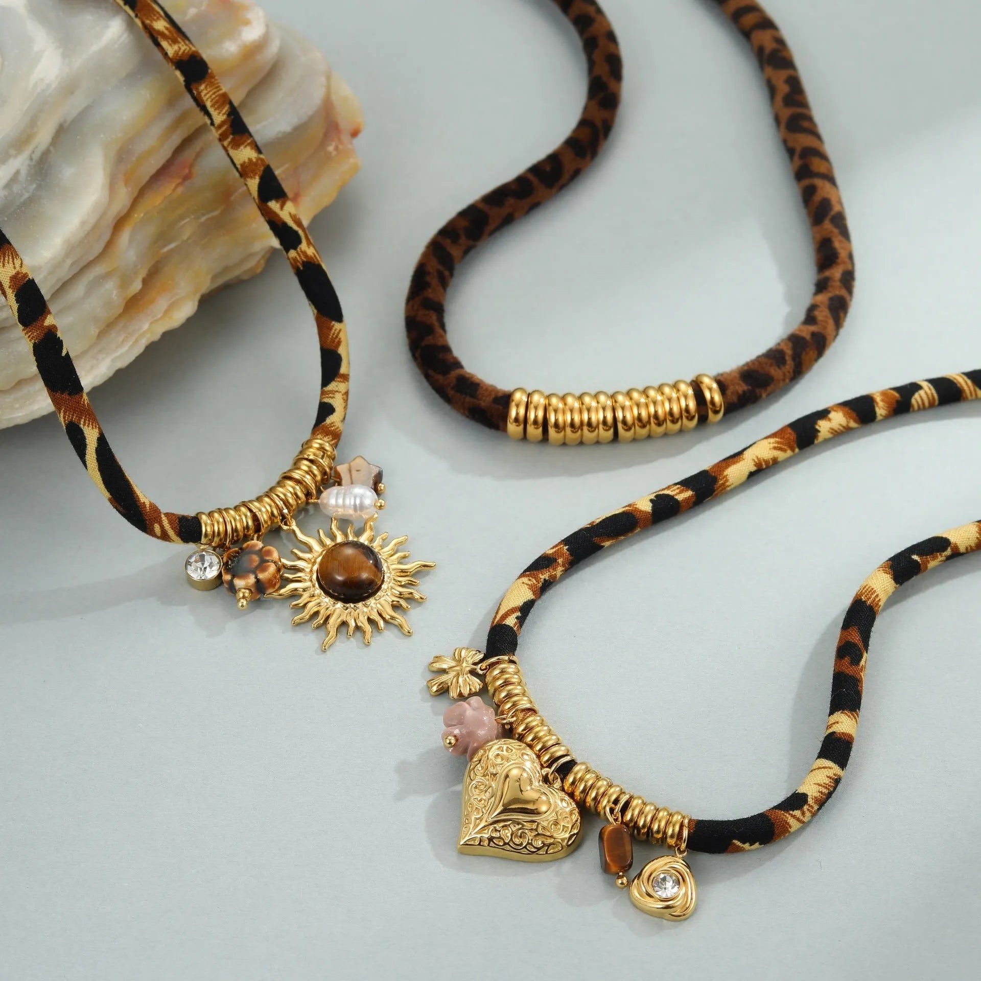 Geometric leopard pendant stainless steel necklace with gold-toned electroplated finish and adjustable chain
