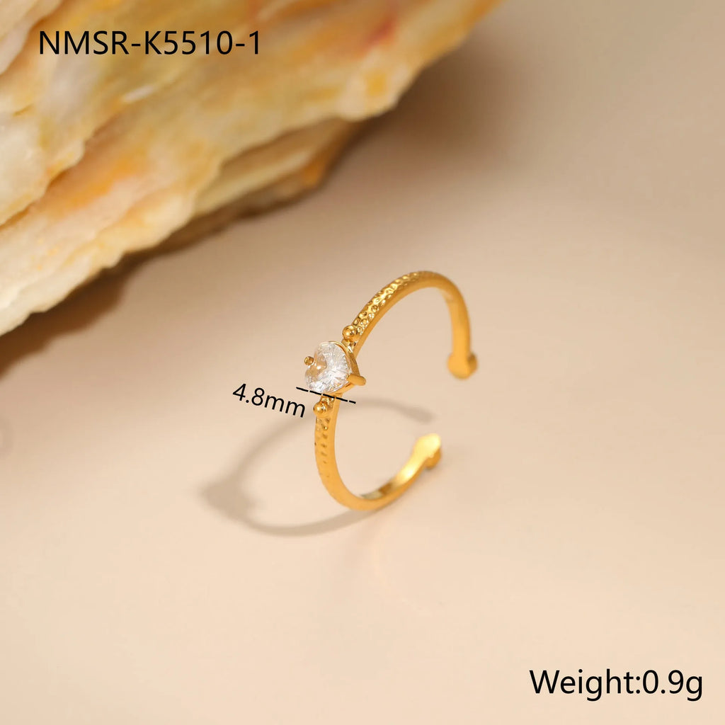 Open ended geometric heart shaped ring with inlaid zircon stones in stainless steel