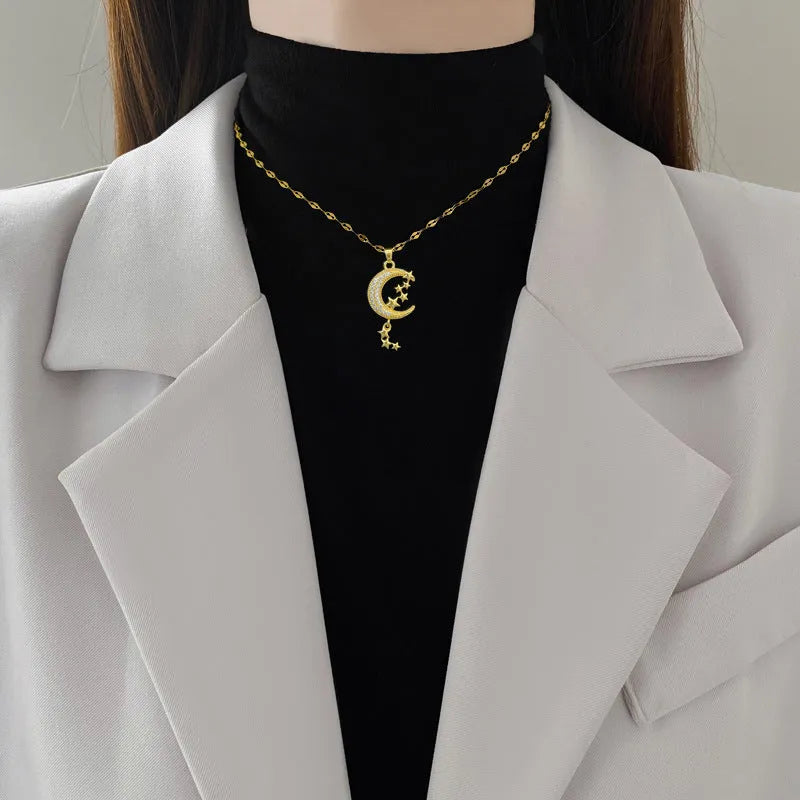 Stainless steel moon pendant necklace with geometric diamond pattern and copper accent