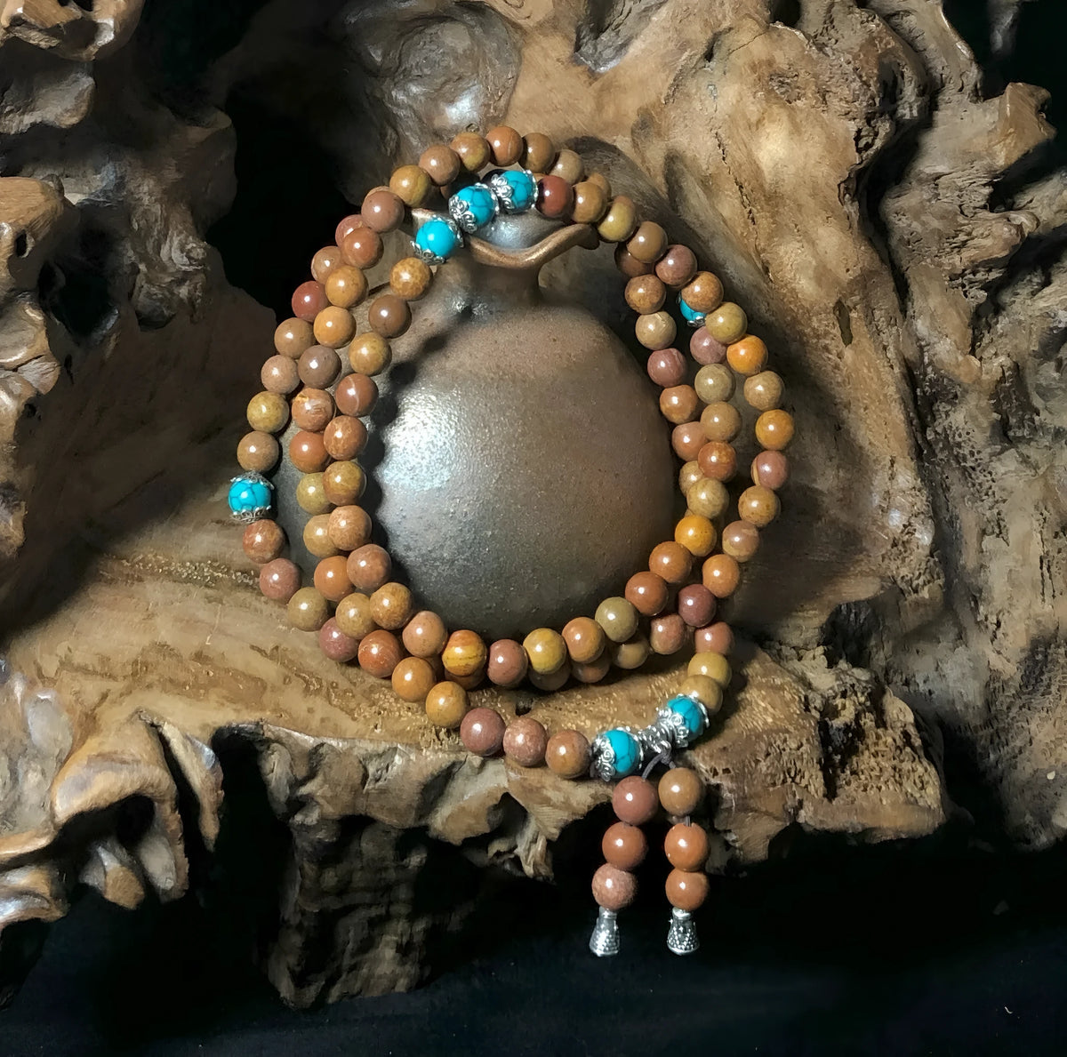 108 bead Lvzhu stone bracelet with 5-6mm geometric beads on wrist