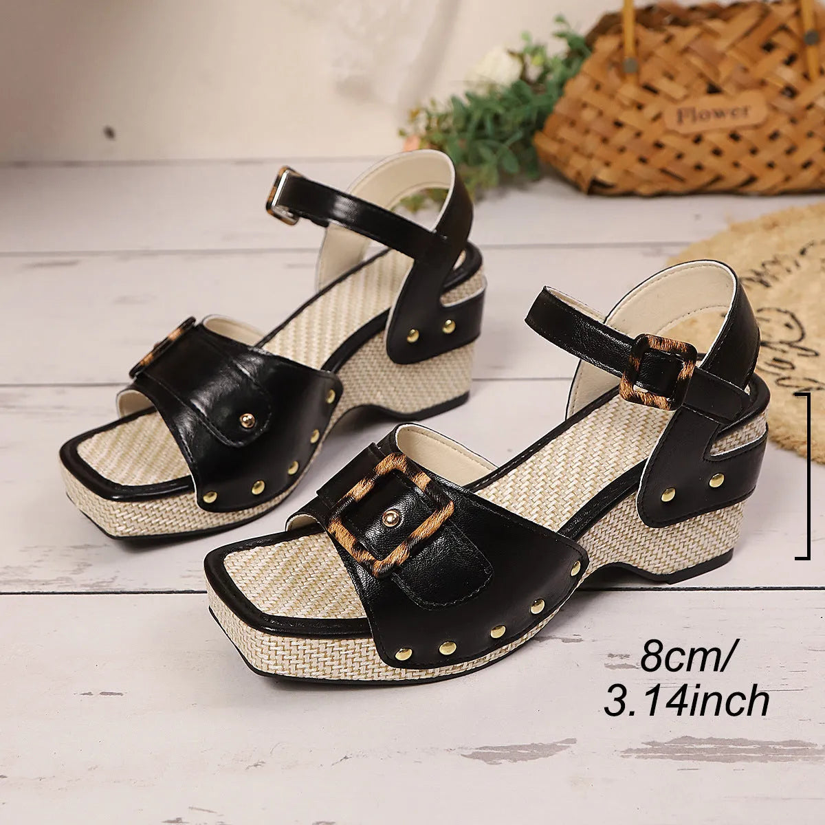 White women's chunky heel sandals with square toe and metal buckle closure on a light background.