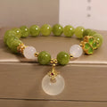 Natural green tourmaline women's bracelet with four-leaf clover design and safety buckle in New Chinese style