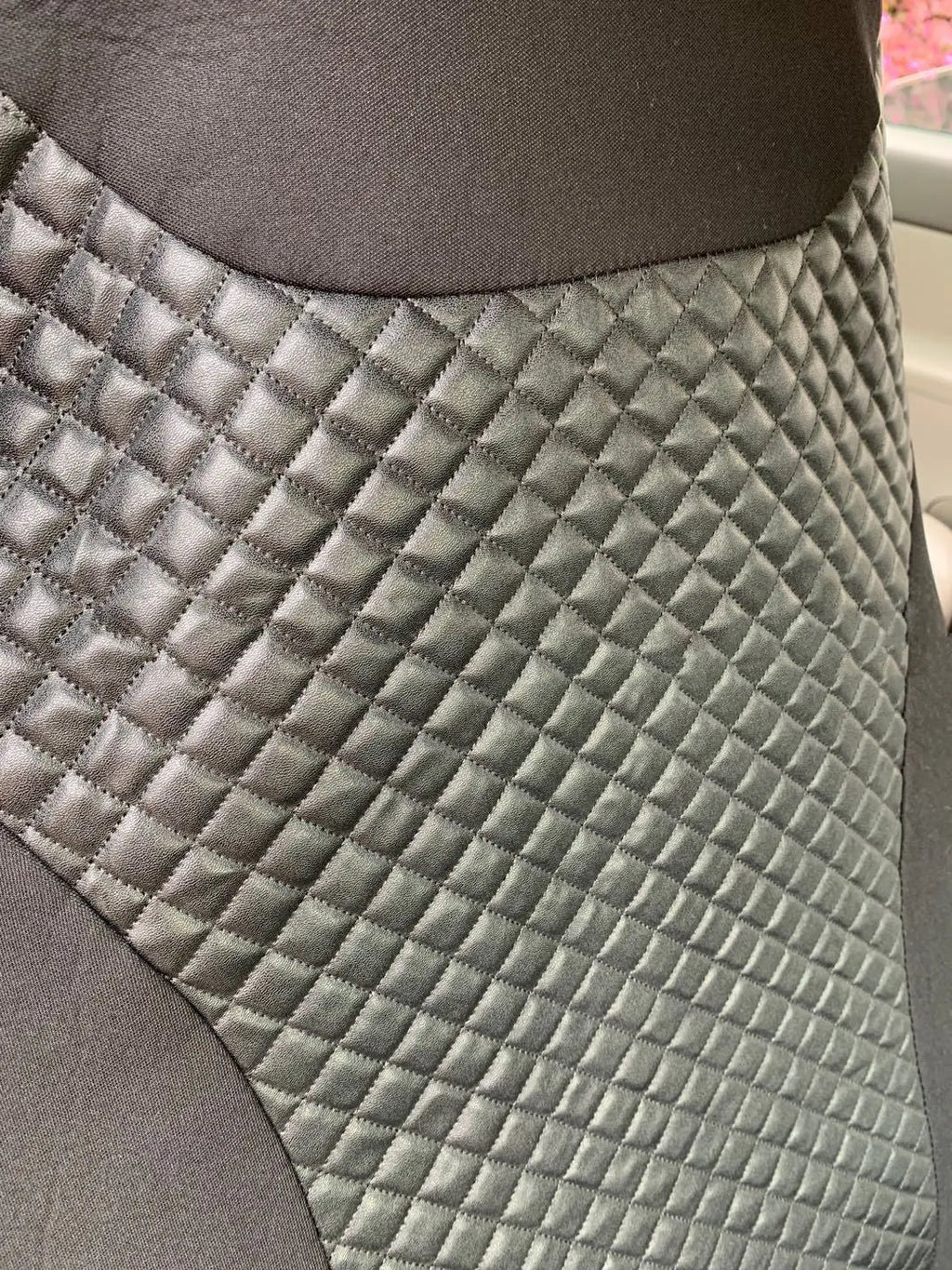 Black quilted automotive seat cover for universal car seats with plastic installation hooks