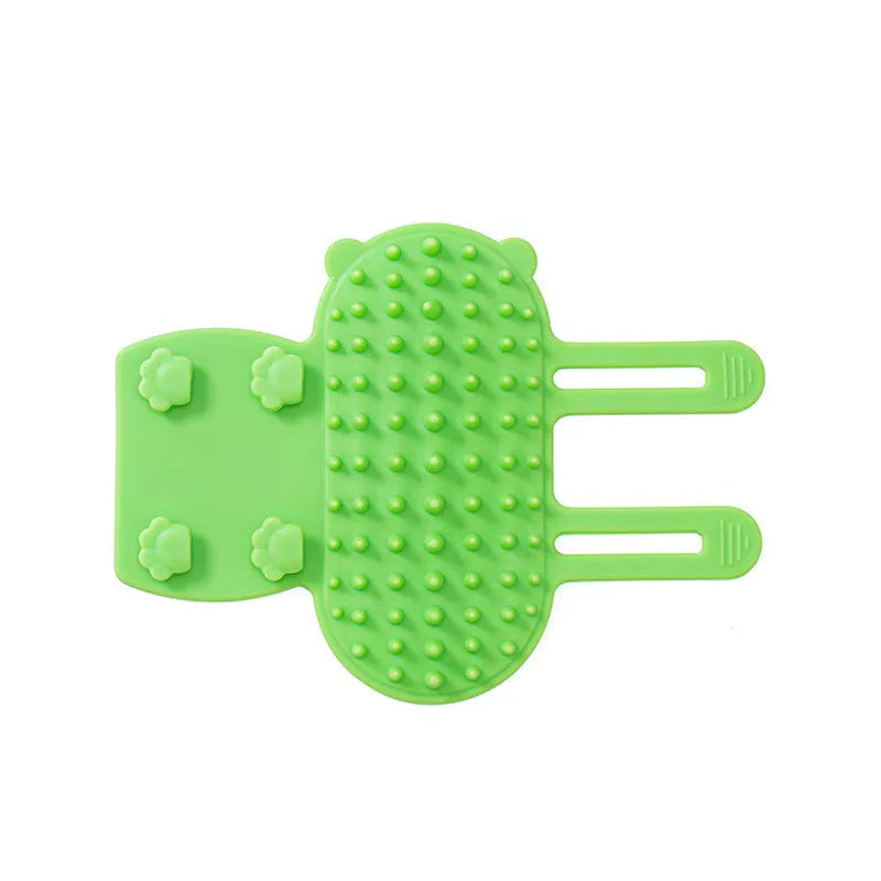 Silicone cat grooming comb scratcher with adjustable strap mounted on a table leg