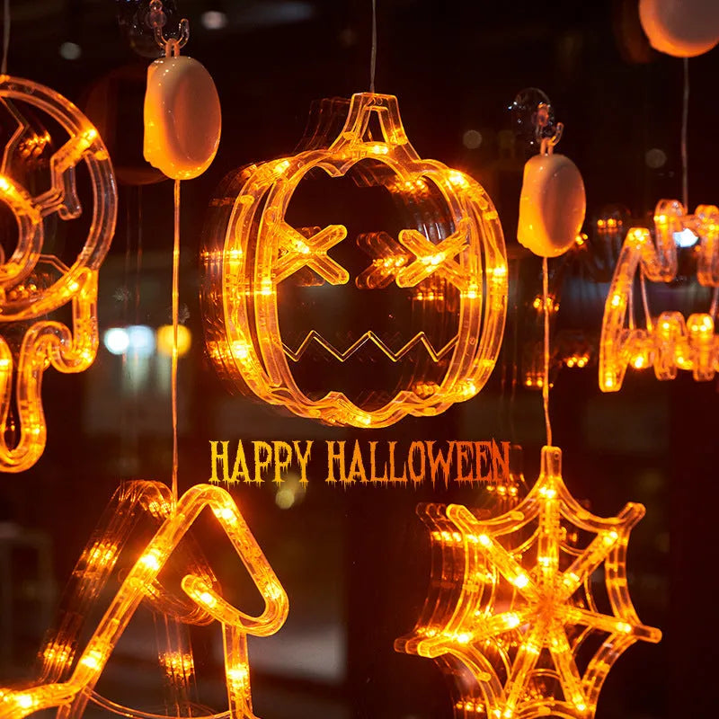 Halloween LED window lights showing spider, pumpkin and ghost designs with suction cup mounting