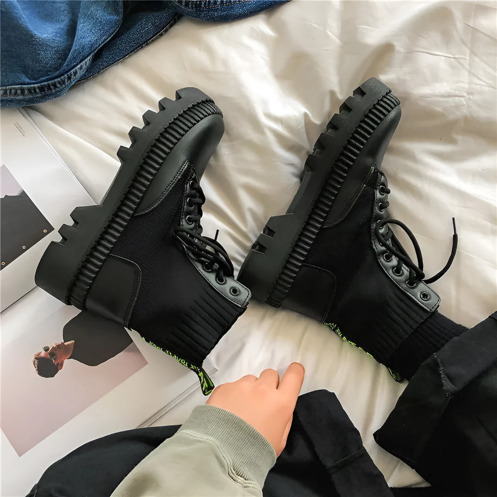 Black men's Dr. Martens platform boots with frosted cowhide upper, side zipper, and lace-up design.