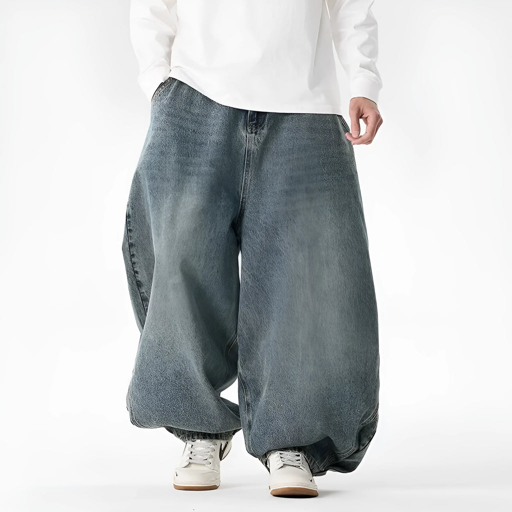Men's plus size wide leg baggy jeans in black denim on a hanger