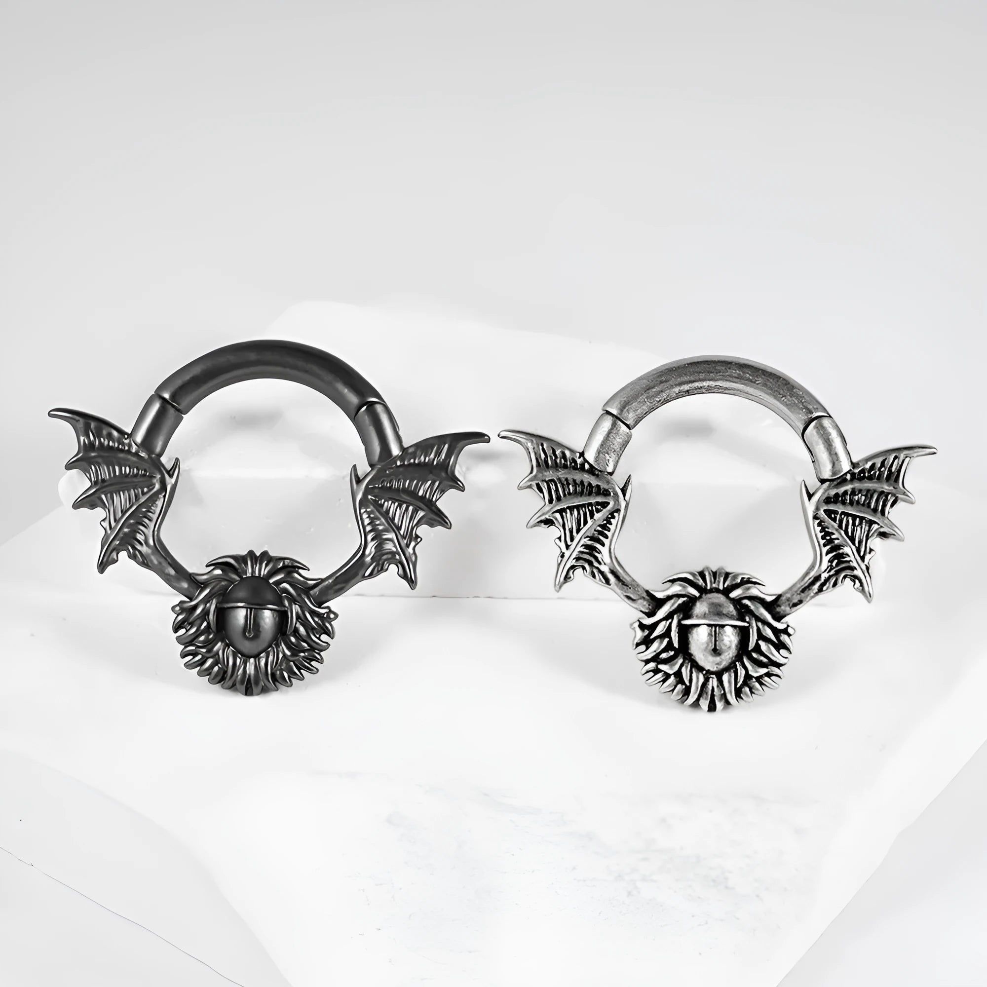 A pair of geometric sharp cone round ear tunnel stretchers with a magnetic closure, made from copper.
