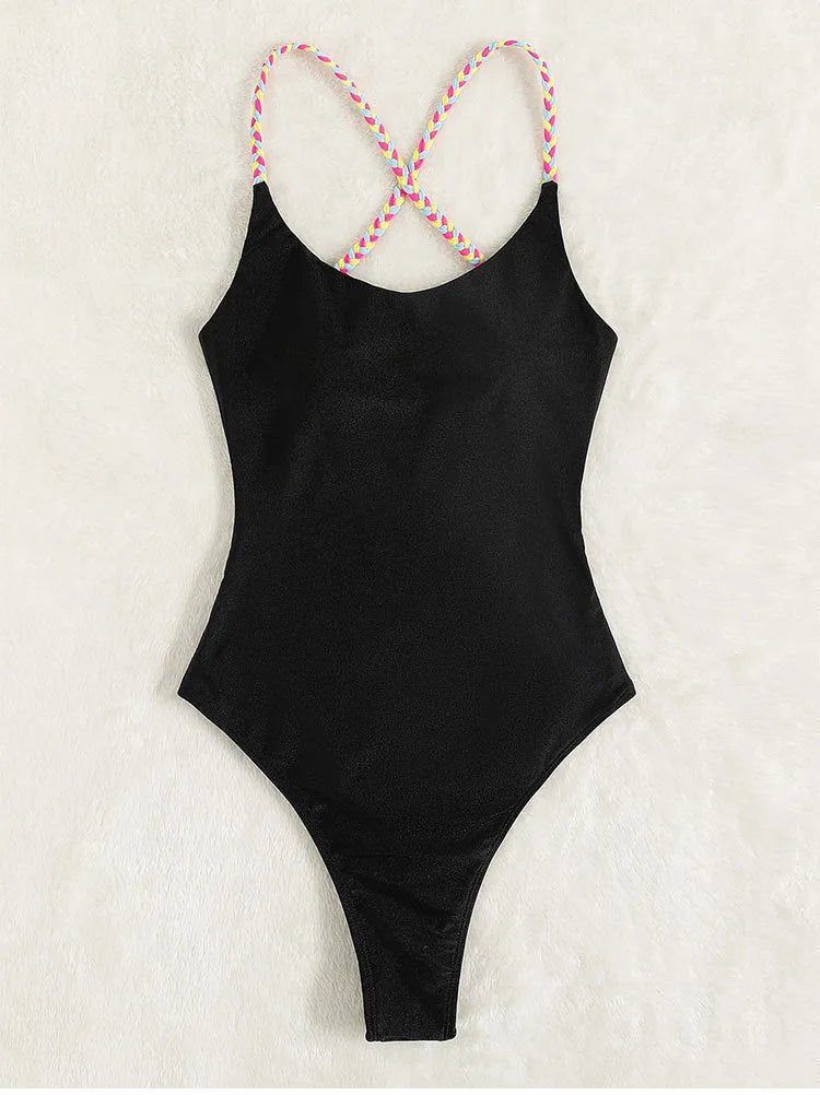 Black backless one-piece swimsuit with sleeveless design on mannequin