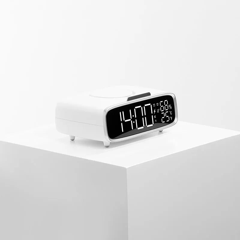 White wireless charging Bluetooth speaker with night light and alarm clock display on desk