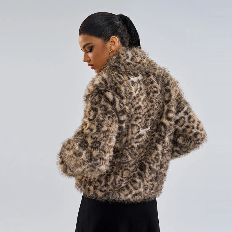 Women's leopard print polyester coat with regular sleeves on a hanger