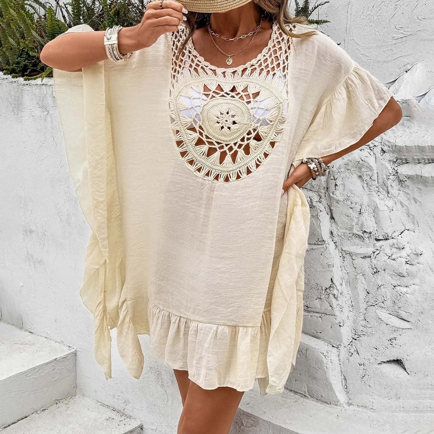 Textured crochet-style patchwork skirt dress in slubbed fabric shown as a beach cover-up.