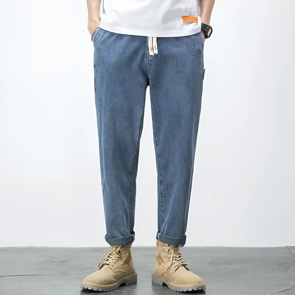 Men's loose fit plus size jeans with elastic mid waist, thin cotton denim, blue or black, sizes L to 7XL