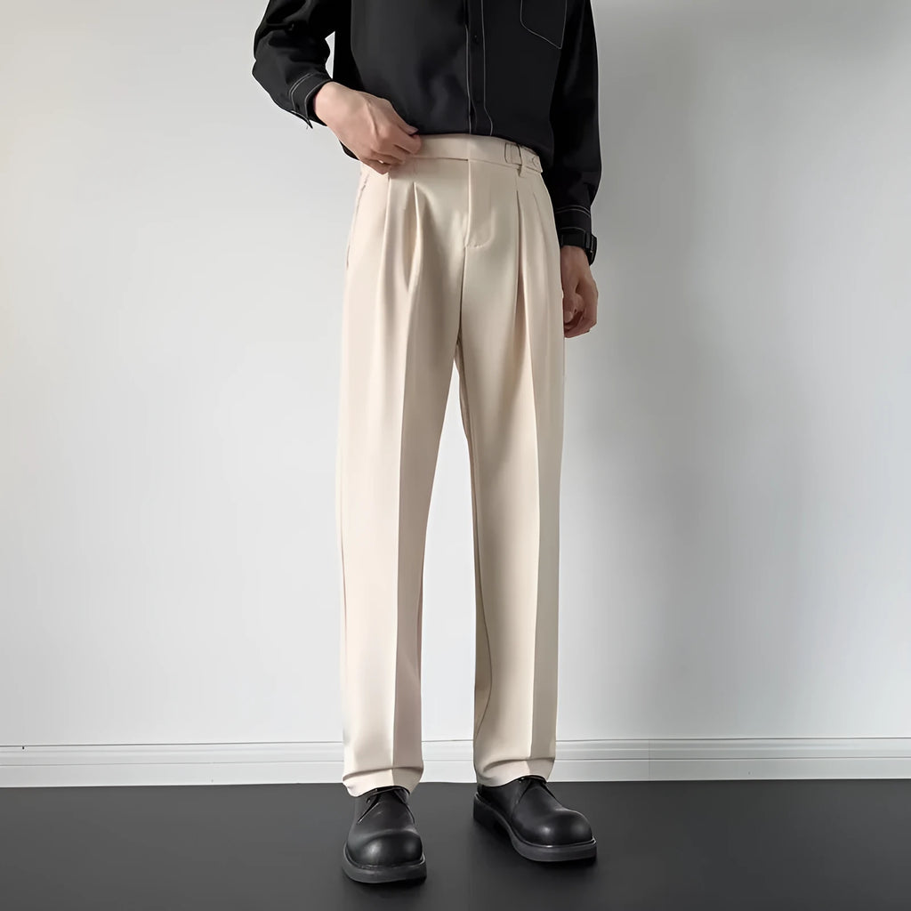 Apricot and black men's straight loose-fit suit trousers on a hanger.