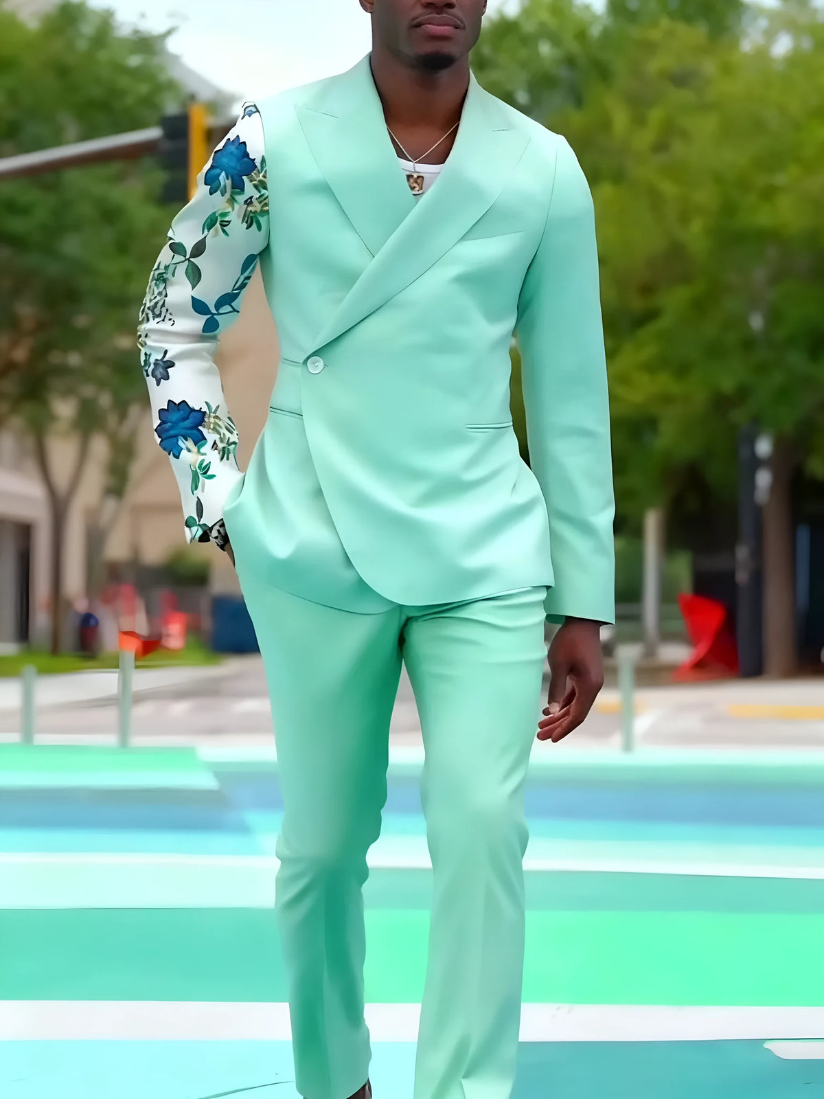 Mint green double-breasted suit set with floral print sleeve and ankle-length trousers.