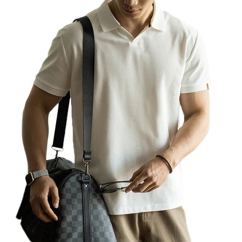 Blue short-sleeved cotton blend polo shirt on a hanger, showing regular fit and button placket.