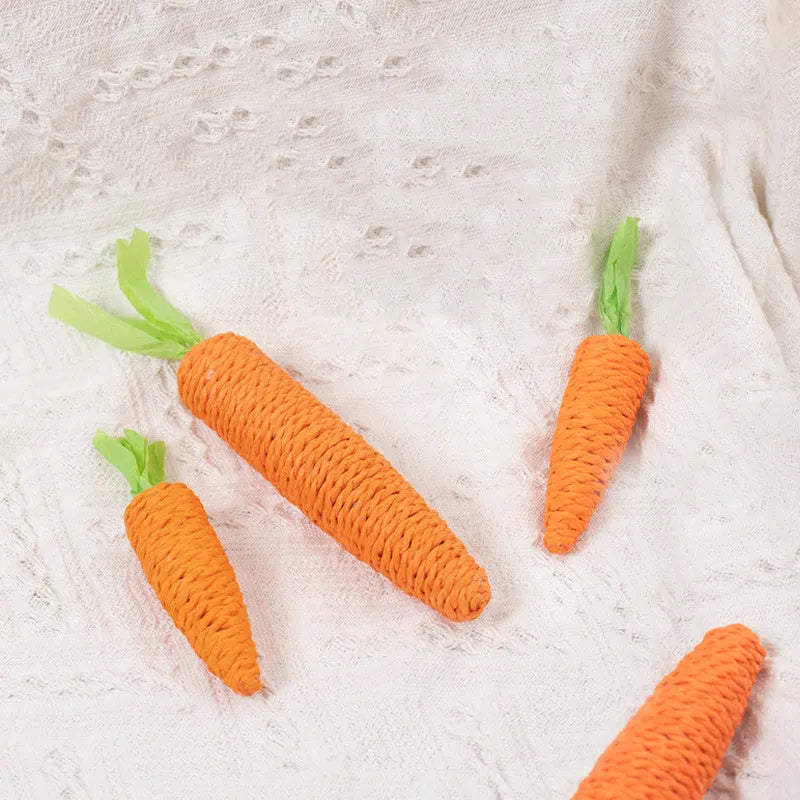 Interactive cat toys set with carrot-shaped bites, paper rolls, ringing stones, feather sticks, and dental grinding sticks