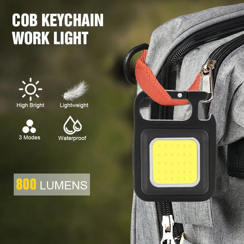 Black aluminium USB rechargeable keychain flashlight with magnetic base and foldable handle