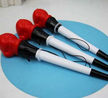 Four pressure relief pens with boxing ejection mechanisms and black ink refills
