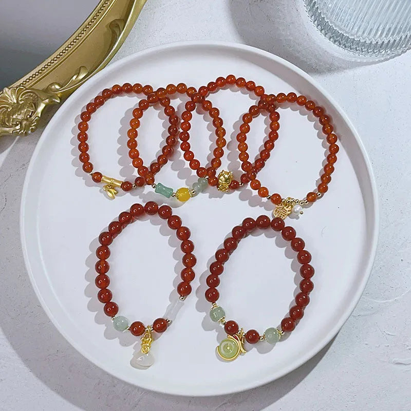 Red agate bracelet with Chinese lucky bag design and dragon motifs for women