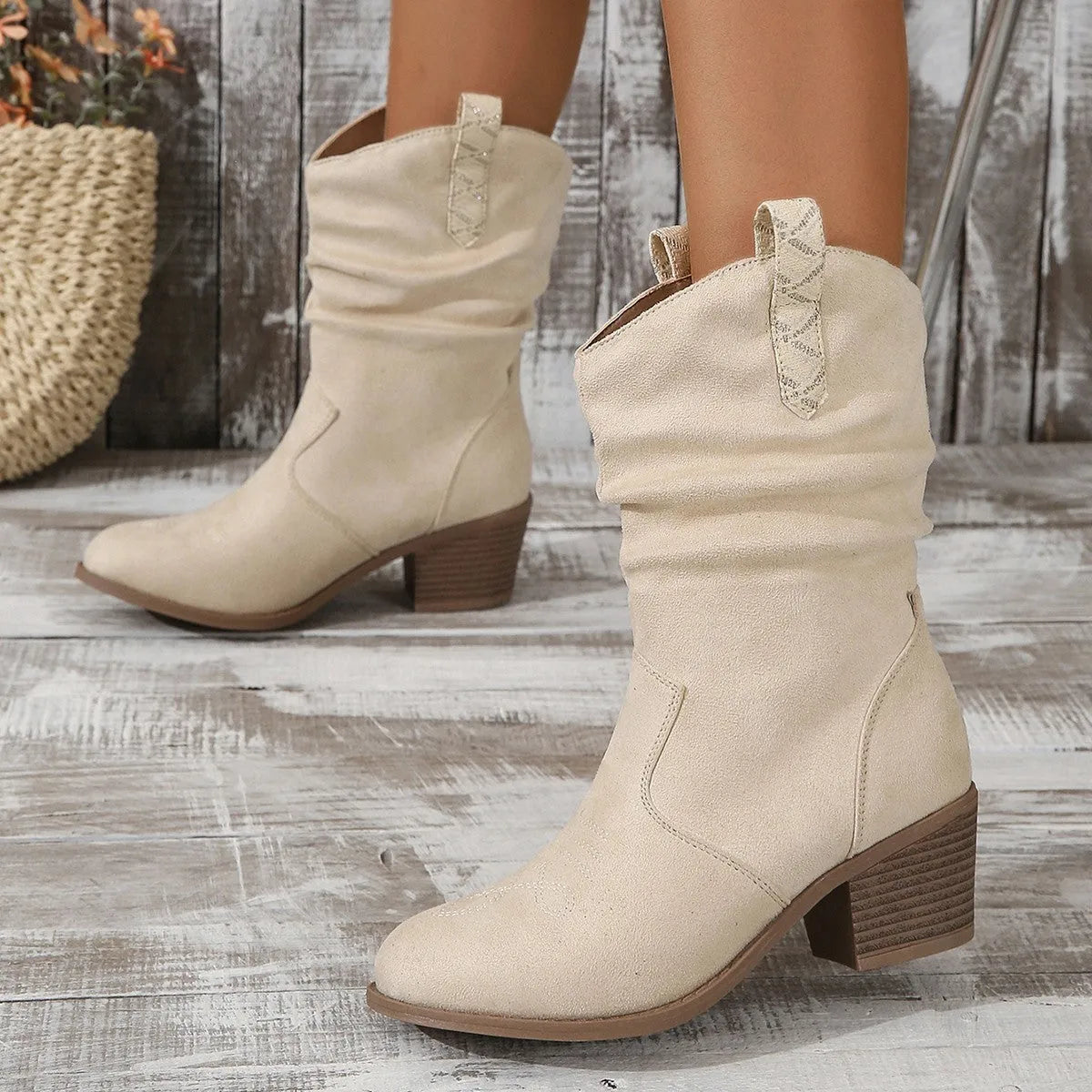 Women's plus size mid-calf suede boots with a short stout heel in lotus root colour.