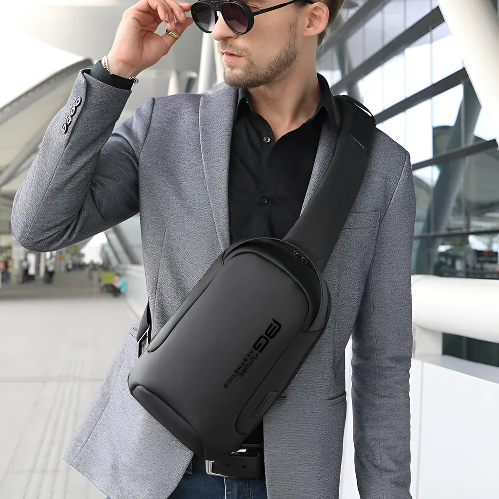 Men's black Oxford cloth shoulder bag with a USB charging port for business travel.