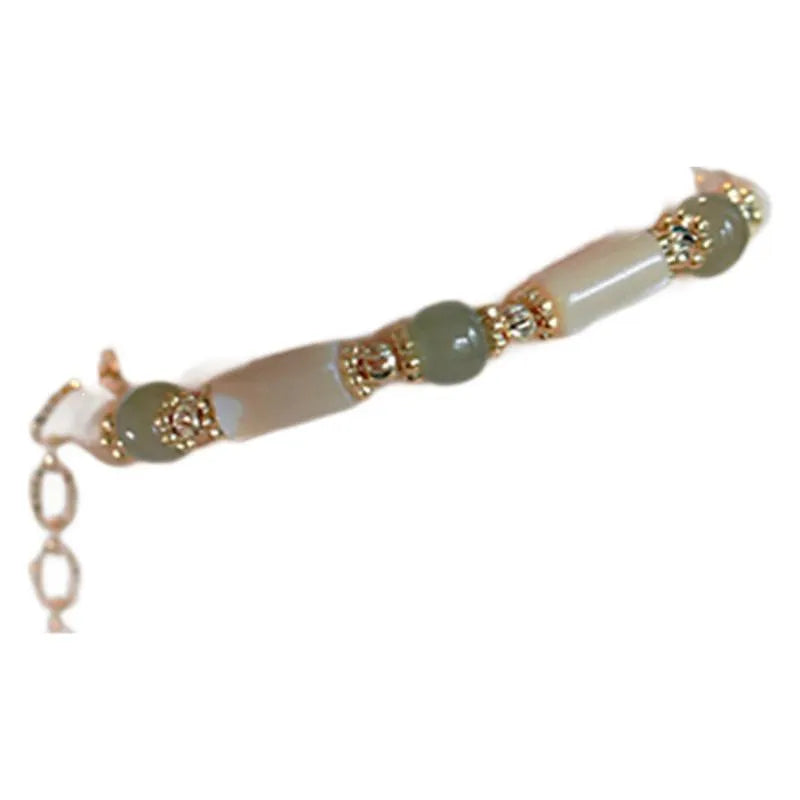 Natural white Hetian jade bead bracelet with geometric round beads on wrist