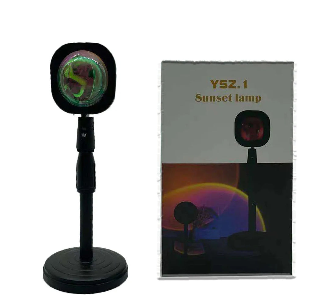 Rechargeable sunset red rainbow projection lamp with USB cable on tabletop