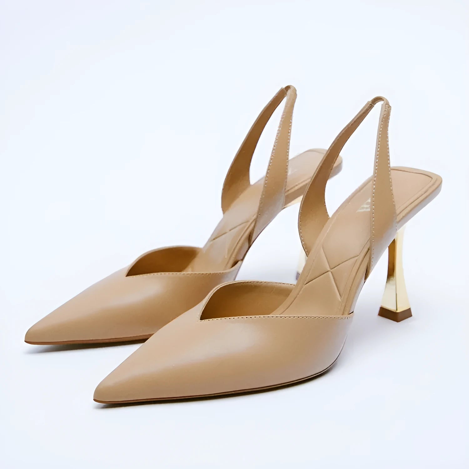 Women's pointed toe patent leather high heels in apricot nude colour, showing shallow mouth design.