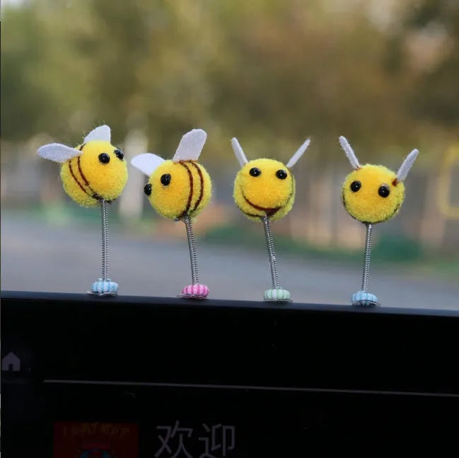 Small furry brown and yellow cartoon bee car decoration ornament measuring 3cm