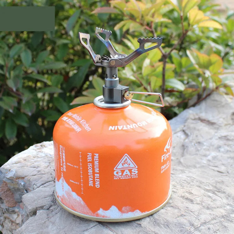 Silver portable mini titanium gas stove for camping and outdoor cooking, lightweight 25g