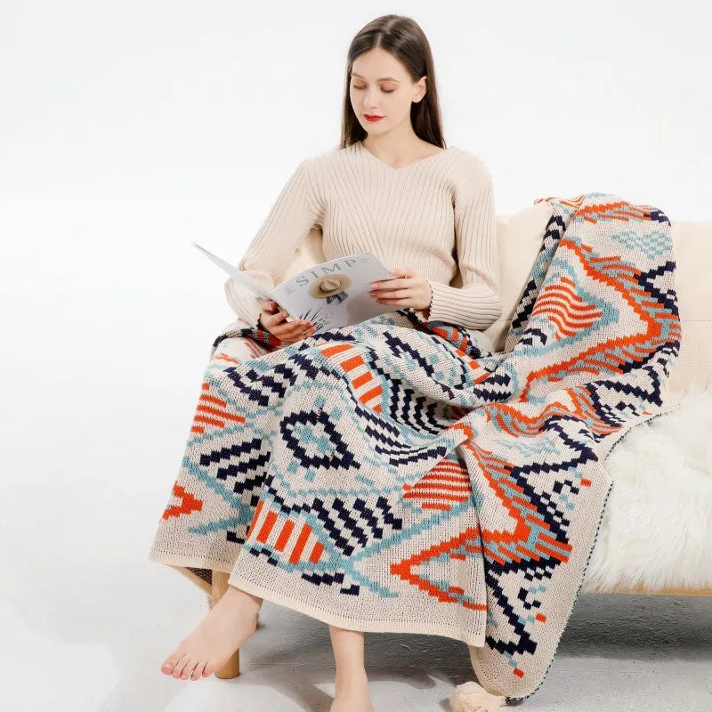 Bohemian-style acrylic sofa cover blanket with tassel trim in a geometric pattern colour option