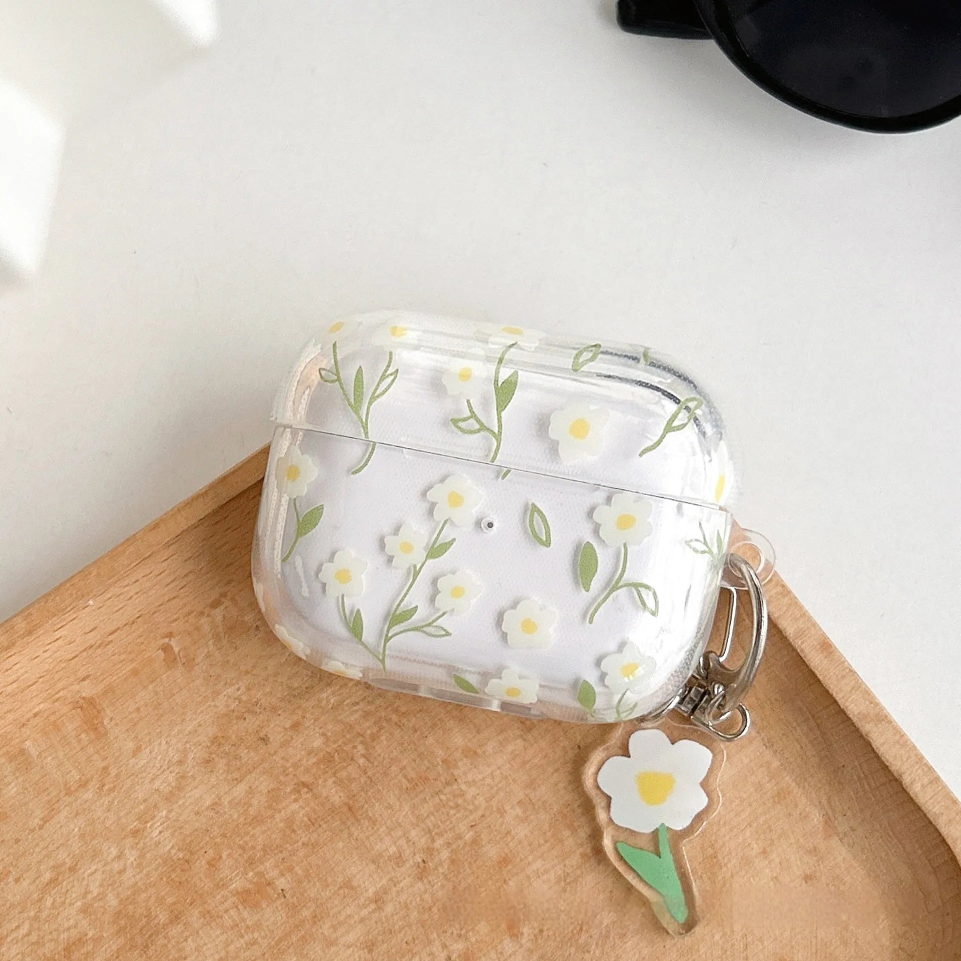 White floral pattern on a transparent TPU protective case for Apple AirPods