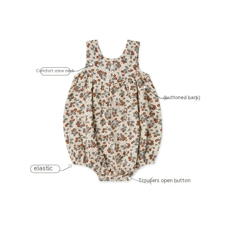 Cotton sleeveless baby romper in floral pattern, triangle jumpsuit style, shown in beige leaves colour, sizes 66cm to 90cm