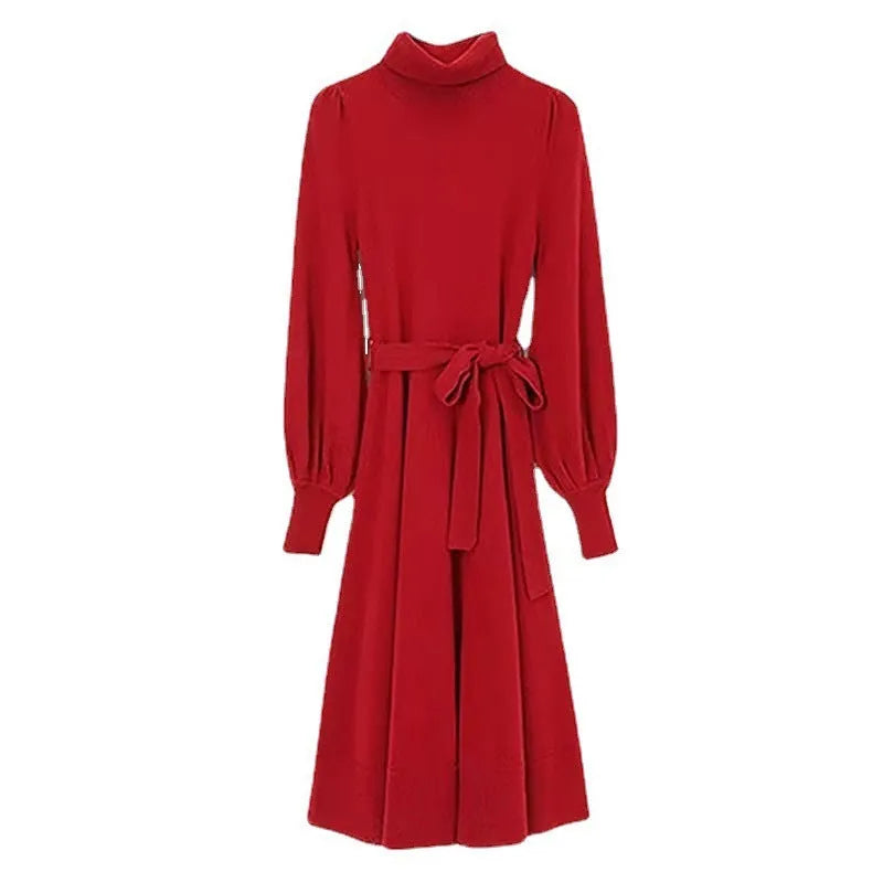 Turtleneck knitwear dress with elastic waist and loose mid-length skirt in solid colour.