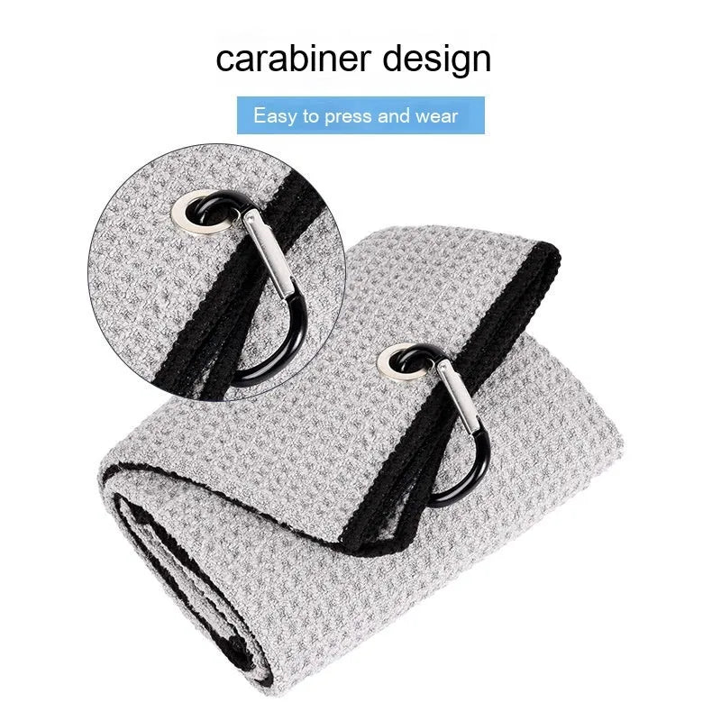 Waffle weave golf ball cleaning cloth in blue, showing textured surface and rectangular shape.
