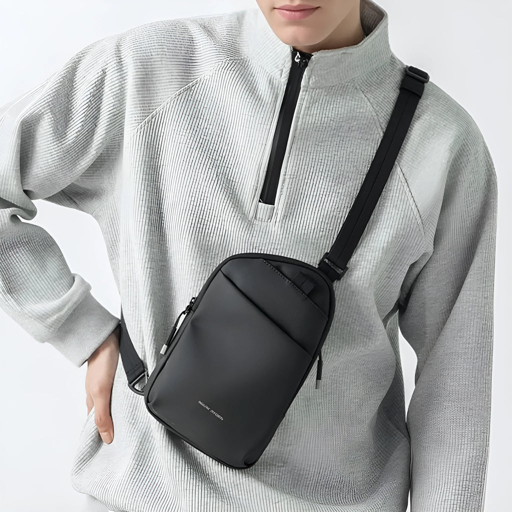 Elegant black men's lightweight crossbody bag made from Oxford cloth with sewing thread detail.