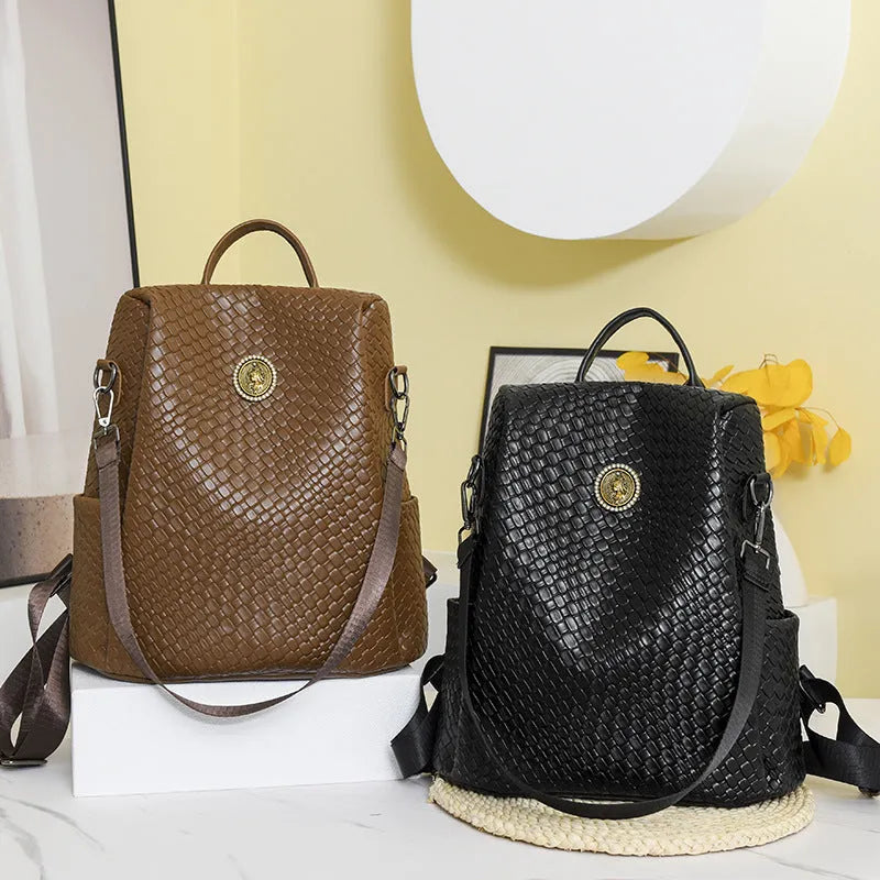 Women's black anti-theft backpack with waterproof PU material and internal organisation compartments