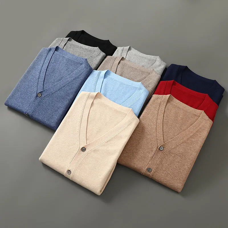 Man wearing a loose beige Andy velvet V-neck cardigan coat with long sleeves