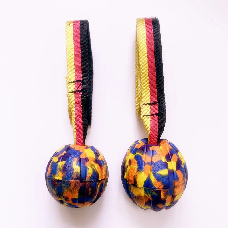 Floating EVA pet string ball in camouflage or yellow colour with attached string for water retrieval games