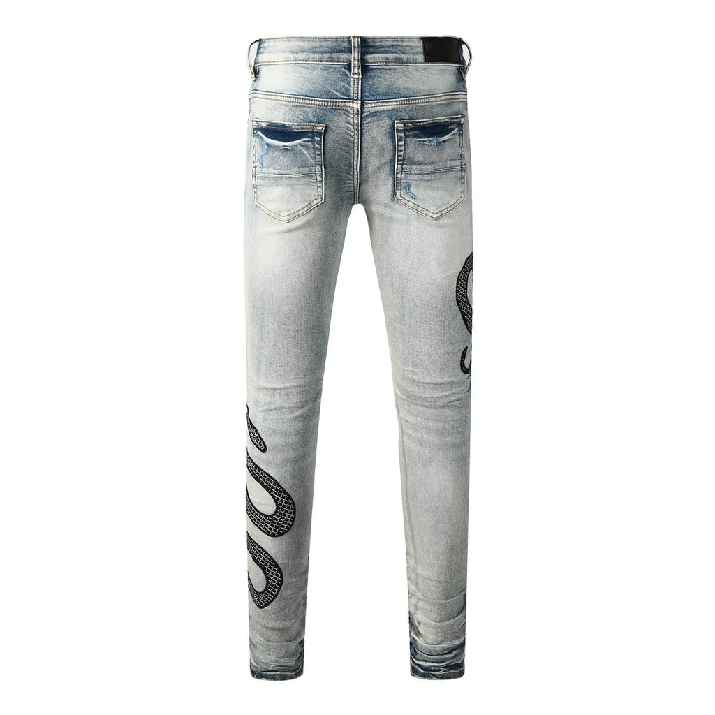 Blue distressed wash skinny jeans with mid waist and skinny leg silhouette