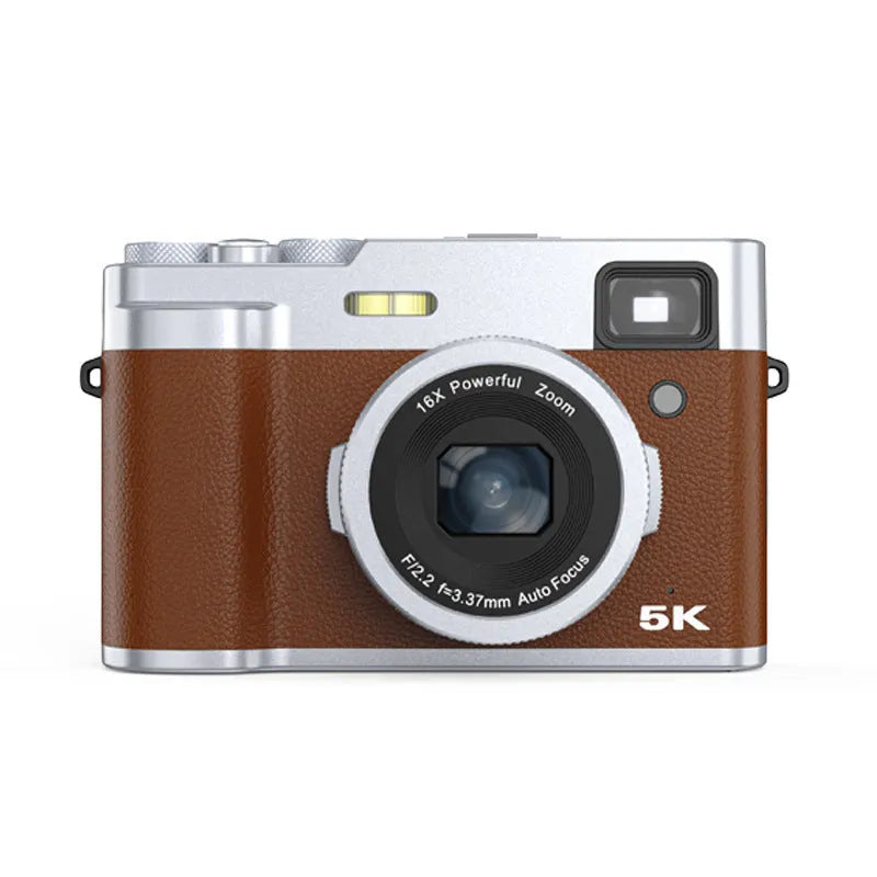 Black 5K digital camera with dual lenses and optical viewfinder displayed with accessories