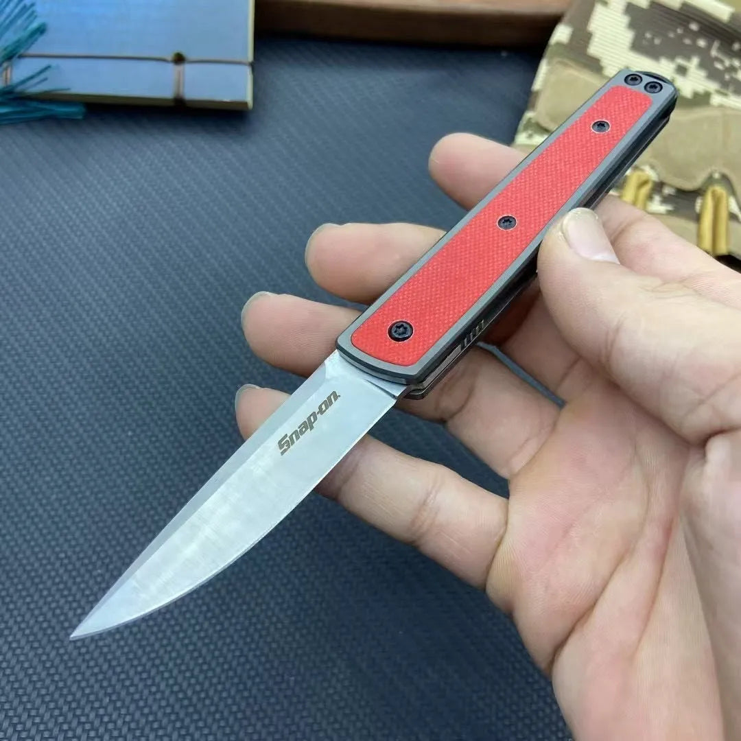 Folding fruit knife with stainless steel blade showing black, coffee colour, and red handle options
