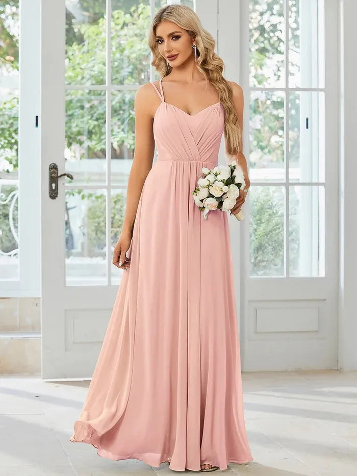 Women's sleeveless A-line pleated dress with sling neckline in light green colour