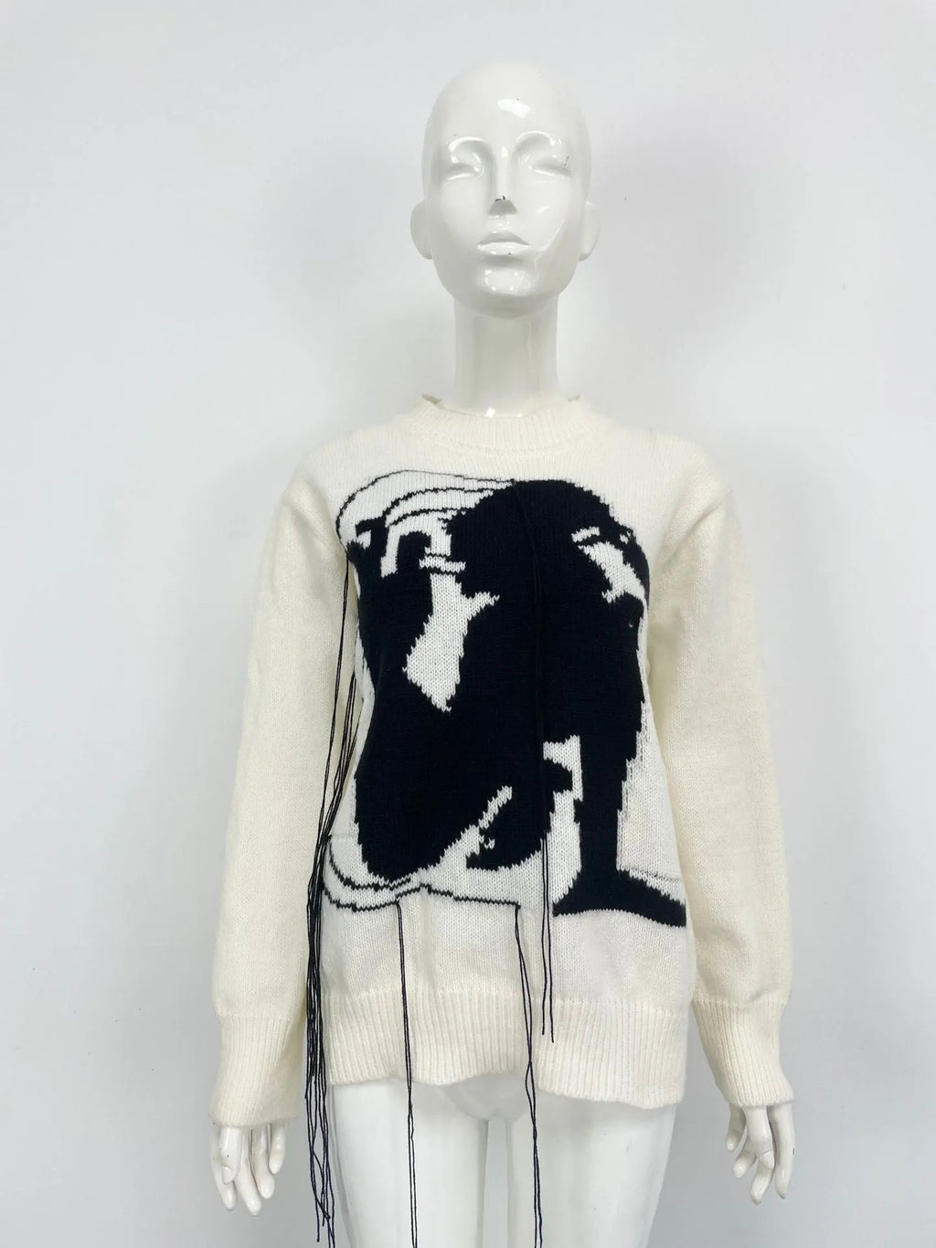 Women's loose fit alpaca wool sweater with tassel details and abstract pattern in street fashion style